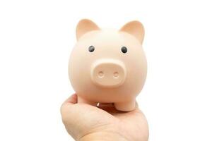 Piggy Bank on palm of hand with isolated background. photo