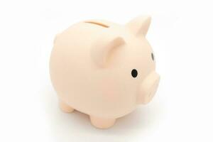 Piggy bank isolated on white background. Saving pig, small money box, planning home finances concept. photo