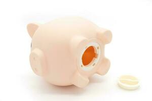 A falling piggy bank with no money in isolated on white background. bad feeling and crisis. Economic depression. Financial crisis, end of savings, bankruptcy. photo