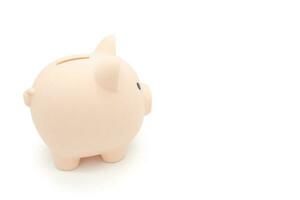 Piggy bank isolated on white background. Saving pig, small money box, planning home finances concept. photo