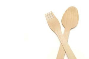 Wooden fork and spoon, isolated background. photo