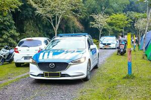 Bogor, East Java, Indonesia, 2023 - Various types of vehicles are used to go to recreational areas on weekends. photo