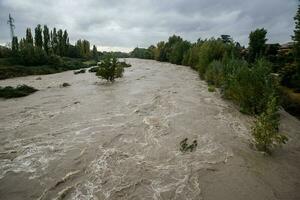 Flood of a river after a period of heavy rain photo