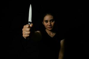 Woman victim of violence and abuse hand hold knife, sexual violence, sexual abuse photo