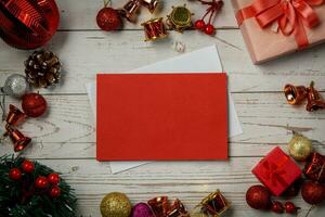 Christmas composition on a white wood background and a blank red card for writing the text. Layout Christmas background concept photo