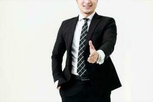 Business Asian man offering handshake ready to a deal at copy space isolated on white background, Partner shaking hands concept. photo