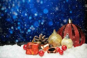 Beautiful christmas decoration on snow with blue bokeh background photo