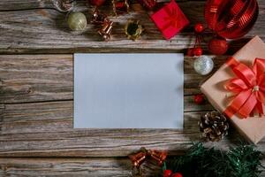 Christmas composition on a wood background and a blank red card for writing the text. Layout Christmas background concept photo