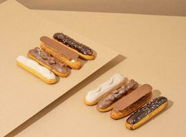 A set of delicious glazed donuts in a variety of flavors, arranged on a cardboard paper in an inviting display photo