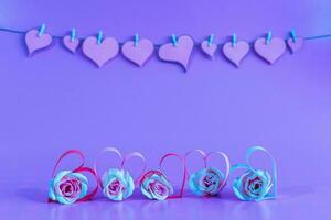 Love hearts and roses on blue background. photo