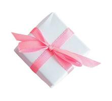 Small white gift box with pink bow, isolated on blank background. Top View. photo