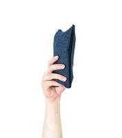 Man's arm raised holding a office supplies pencil case. Isolate on white background. photo