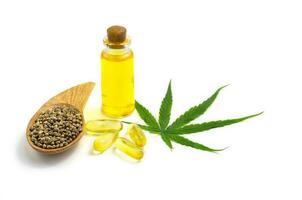 bottle with hemp oil, hemp leaf and seeds on white background, CBD oil hemp products, cannabis extract oil, Medical marijuana. photo