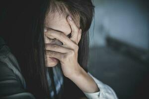 Women sitting on the floor  with depression,  family problems,  Domestic violence, Stop violence and abuse ,sexual abuse, human trafficking,  rape,  The concept of depression and suicide, photo