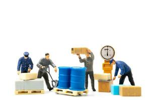 Miniature people , Worker team standing on white background, Labour day concept photo