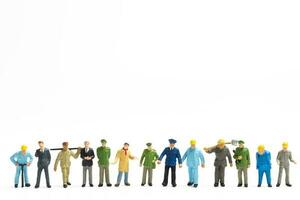 Miniature people different professions standing on white background , Labour day concept photo