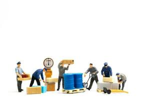 Miniature people , Worker team standing on white background, Labour day concept photo