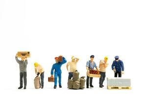 Miniature people , Worker team standing on white background, Labour day concept photo