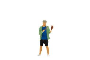 Miniature people Young man grilling BBQ photo