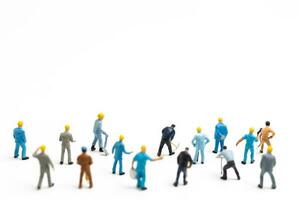 Miniature people , Worker team standing on white background, Labour day concept photo