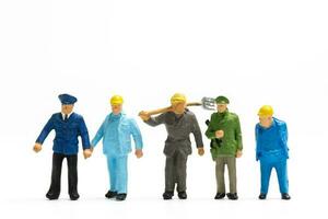 Miniature people different professions standing on white background , Labour day concept photo