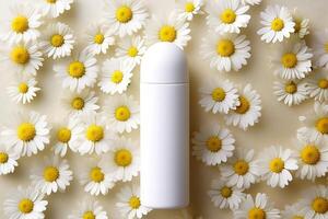 Mock-up tube of white cream in chamomile flowers. photo