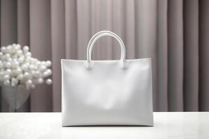 A mock-up of a white cloth bag is on the table. photo
