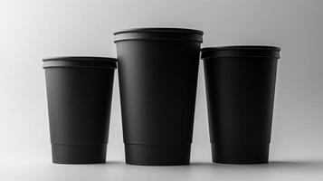 Black paper cups with white background create a modern, sleek look for branding. photo