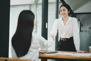 Business woman offer and give hand for handshake in office. Successful job interview. Apply for loan in bank photo