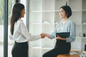 Business woman offer and give hand for handshake in office. Successful job interview. Apply for loan in bank photo