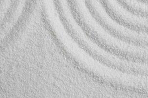 Zen garden with line pattern in white sand in Japanese style, Sand texture with the wave parallel lines pattern,Harmony,Meditation,Zen like concept photo