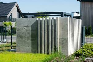 The concrete structure closes the garbage cans or transformer photo