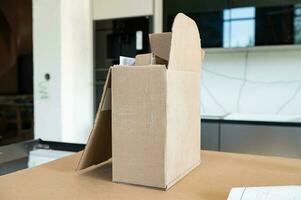 An open cardboard box. Indoor renovation photo