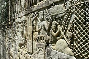 Bas-reliefs on a wall in Angkok Thom in Siem Reap photo