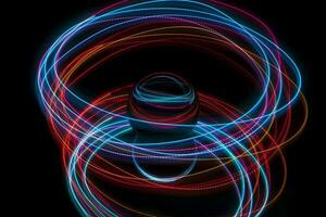 Abstract light painting circling around a glass ball photo