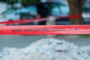 Watch out, power line - Bosnian barricade tape photo