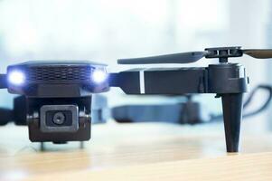 Close-up front view of a black drone. photo