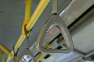 jakarta, indonesia-18 june 2023 transjakarta bus handles with the theme of transjakarta bus interiors photo