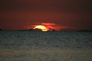 beautiful sunset on the beach photo