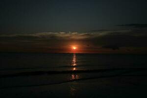 beautiful sunset on the beach photo