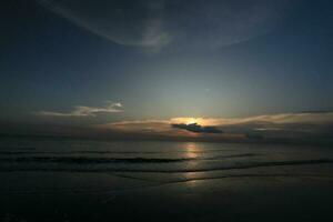 beautiful sunset on the beach photo