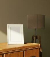 Little frame mockup on the wooden dresser with standing lamp decoration got light form the window photo