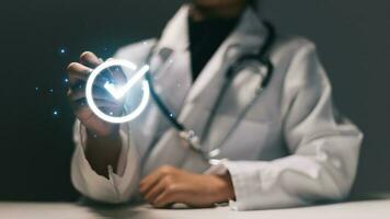 Close up of female doctor with stethoscope working on virtual screen photo