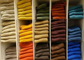 Colorful socks on shelf in a shopping mall. photo