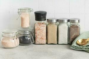 Jars with assorted speciality salt photo