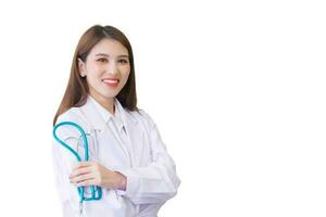 Professional young Asian woman doctor standing with arms crossed happy and smile in hospital. Wearing white robe and stethoscope while isolated on white background.. photo