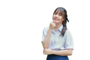 Beautiful Asian high school student girl in the school uniform with smiles confidently while she looks at the camera happily while isolated on white background. photo