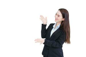 Professional young business working Asian female wearing a black suit stands and present something while she smiles happily isolated on white background. photo