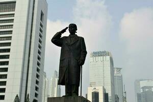 Jakarta, Indonesia-18 June 2023 jendral sudirman statue in sudirman street photo