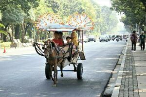 jakarta, indonesia-23 april 2023 delman base on the edge of the city road photo